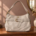 Cartera de hombro Rosetti gris perla con cinturón y hebilla dorada
